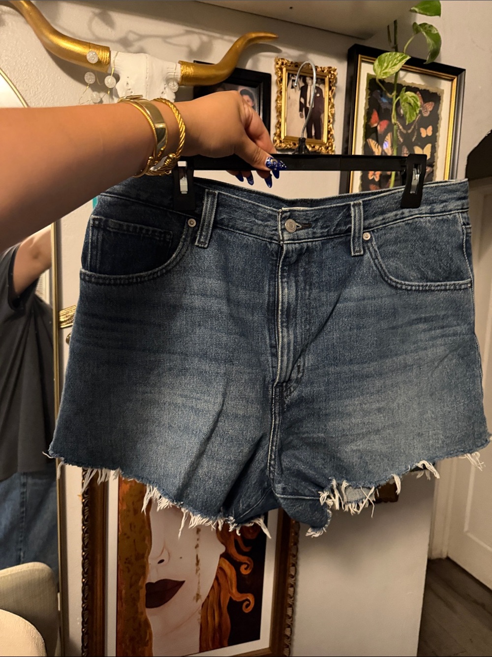 Levi’s High-Rise Raw Hem Denim Shorts in Medium Blue